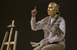 Marina Abramovic performing Joseph Beuys's "How To Explain Pictures to a Dead Hare" (1965) at the Solomon R. Guggenheim Museum on Nov. 13, 2005. Photo: Kathryn Carr